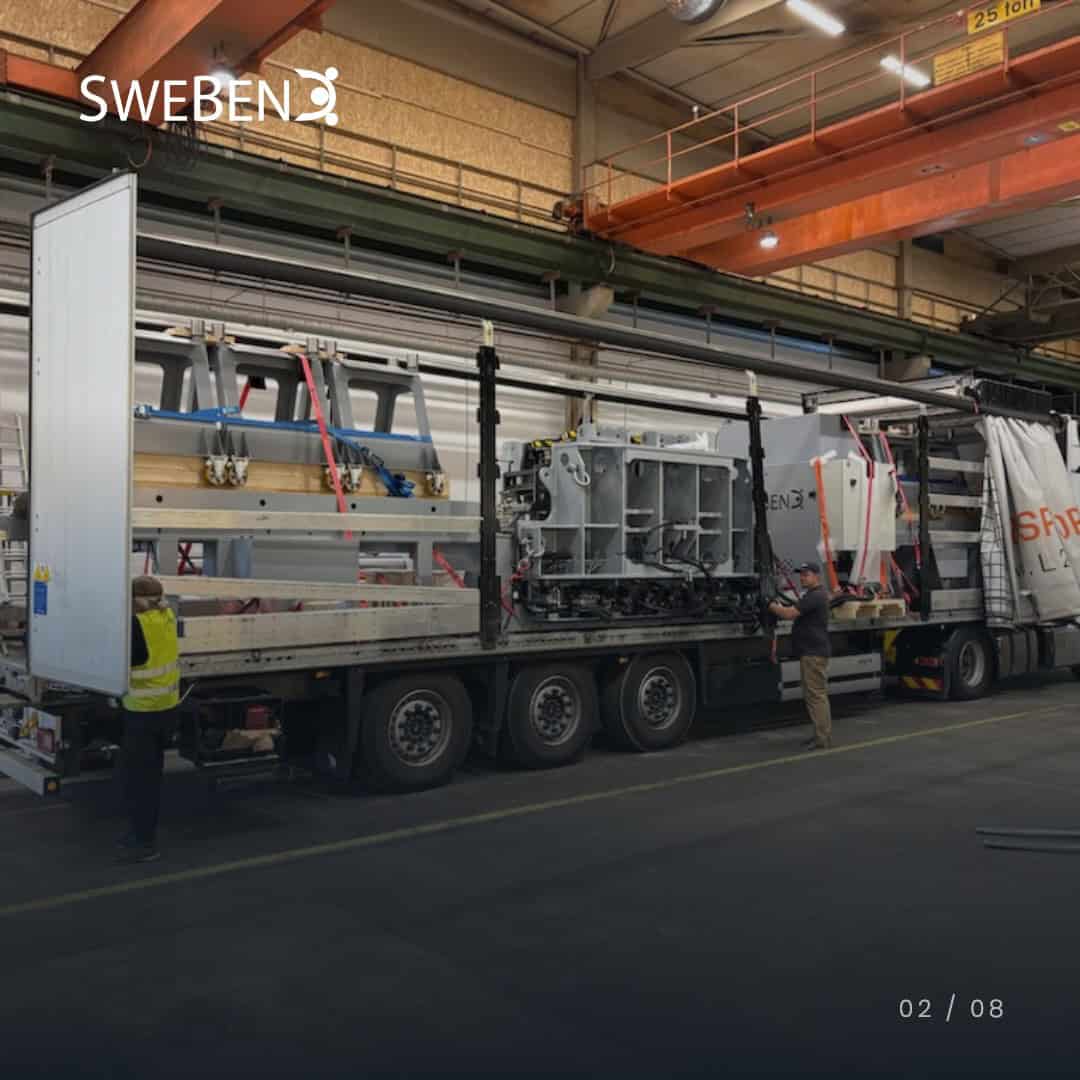 SweBend VSB3-70 CNC section bending machine strapped down on a flatbed trailer before shipping to GVB Infra